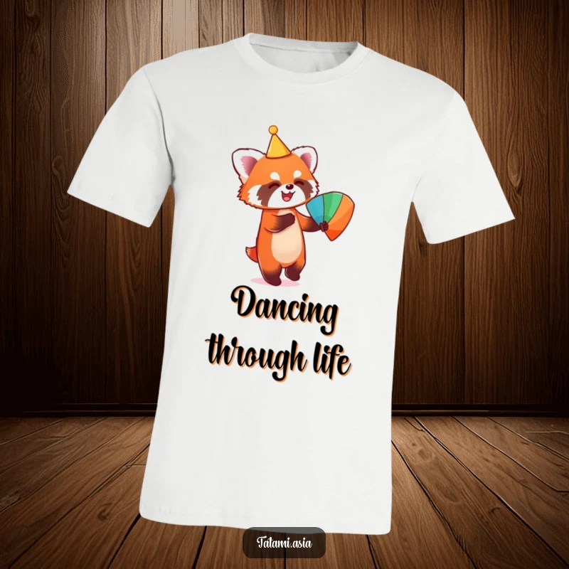 Funny t-shirt depicting a playful red panda in a conical hat, joyfully dancing with a colorful fan.